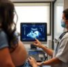 Cardiologist performing a 2D Echocardiography test on a patient at a Pune cardiac clinic